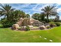 Rock waterfall and landscaping at the entrance to the River Strand community at 7005 River Hammock Dr # 206, Bradenton, FL 34212