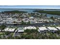 Aerial view of the coastal neighborhood and surrounding waterways at 10423 Waterbird Way # 10423, Bradenton, FL 34209