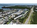 Coastal community aerial showing neighborhood layout and proximity to waterways at 10423 Waterbird Way # 10423, Bradenton, FL 34209