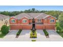A stunning exterior view of the townhomes and a beautiful manicured lawn at 11507 84Th Street E Cir # 102, Parrish, FL 34219