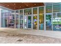 Modern building entrance showcasing glass facade and a view to the interior lobby at 1155 N Gulfstream Ave # 406, Sarasota, FL 34236