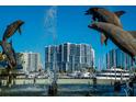 Dolphin fountain with high rise apartments in the background in the marina district at 1155 N Gulfstream Ave # 406, Sarasota, FL 34236