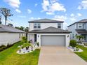 Charming two-story house showcasing a landscaped yard and an inviting front entrance at 11783 Moonsail Dr, Parrish, FL 34219