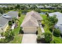 Charming single-story home featuring a well-maintained lawn, mature palm trees, and an attached two-car garage at 12183 Longview Lake Cir, Bradenton, FL 34211