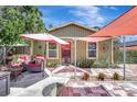 Inviting home exterior with a cozy patio setup, perfect for outdoor relaxation and entertaining at 1489 18Th St, Sarasota, FL 34234