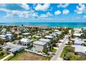 Beautiful coastal home with a private pool and the beach within walking distance, offering a serene lifestyle at 215 65Th St, Holmes Beach, FL 34217