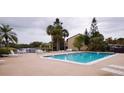 Community swimming pool with plenty of room to relax and lounge at 2733 Hidden Lake Blvd # A, Sarasota, FL 34237