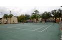 Well maintained community tennis courts with green surfaces and nets ready for play at 2733 Hidden Lake Blvd # A, Sarasota, FL 34237