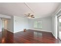 Spacious living room with hardwood floors, a ceiling fan, and large windows for plenty of natural light at 2901 26Th W St # 312, Bradenton, FL 34205