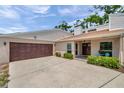 Single-story home featuring an attached garage, well-maintained lawn, and charming front entrance at 3006 Wister Cir, Valrico, FL 33596