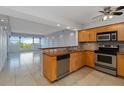 Well-lit kitchen featuring granite countertops, stainless steel appliances, and an open view to the living area at 33 S Gulfstream Ave # 502, Sarasota, FL 34236