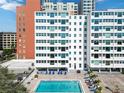 Inviting outdoor pool area surrounded by lounge chairs, offering a relaxing and luxurious experience at 33 S Gulfstream Ave # 502, Sarasota, FL 34236