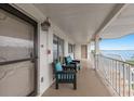 A balcony sitting area with chairs and an ocean view for relaxation and outdoor enjoyment at 3320 Gulf Of Mexico Dr # 307C, Longboat Key, FL 34228