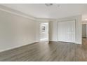 Spacious bedroom with laminate flooring, a double closet and an exit door at 383 Bobby Jones Rd # 383, Sarasota, FL 34232