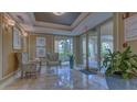 Inviting lobby with tiled floor, ambient lighting, stylish seating, and tropical plants at 385 N Point Rd # 503, Osprey, FL 34229