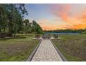 Scenic fire pit area near the lake, perfect for outdoor gatherings at 4225 Ulman Ave, North Port, FL 34286