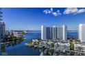 Beautiful waterfront view featuring luxury condos, a bridge, and sparkling blue water with some boats at 555 Quay Cmn # 801, Sarasota, FL 34236