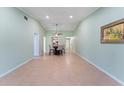 Open concept dining area features tile flooring, neutral paint and a ceiling fan at 5709 13Th W Ave, Bradenton, FL 34209