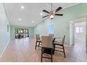 Bright living room features tile floors, vaulted ceilings with fan, and sliding doors to an outdoor patio at 5709 13Th W Ave, Bradenton, FL 34209