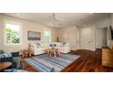Inviting living room featuring hardwood floors, neutral colors, and ample natural light at 603 Emerald Ln, Holmes Beach, FL 34217