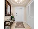 Inviting entryway features stylish decor, a decorative mirror, and a front door at 6512 Midnight Pass Rd # 303, Sarasota, FL 34242