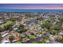 Scenic aerial view of the neighborhood featuring waterfront homes and access to the bay at 6931 Magellan Way, Sarasota, FL 34243