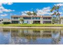 Water view of the backyard of this property with a screened lanai overlooking the serene water at 7193 W Country Club N Dr # 137, Sarasota, FL 34243