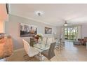 Bright open-concept living and dining room with access to a private lanai at 8105 Grand Estuary Trl # 105, Bradenton, FL 34212