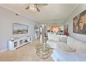 Inviting living area featuring neutral tones, tile flooring, and plenty of natural light at 8105 Grand Estuary Trl # 105, Bradenton, FL 34212