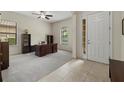 Spacious home office featuring ample natural light, neutral carpet and tiled entry at 9769 Highland Park Pl, Palmetto, FL 34221