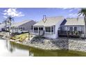 Waterfront home with a private balcony overlooking the canal, offering serene water views at 1322 Perico Point Cir, Bradenton, FL 34209