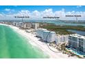 Beautiful aerial view of beachfront condos and beach with the ocean in the background at 1770 Benjamin Franklin Dr # 407, Sarasota, FL 34236