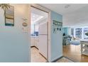 Cozy kitchen adjacent to a living room featuring bright decor and great natural light at 1770 Benjamin Franklin Dr # 407, Sarasota, FL 34236