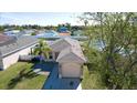 Aerial view of a single-Gathering home with a well-manicured lawn and mature trees in a vibrant neighborhood at 2330 28Th E Ave, Palmetto, FL 34221