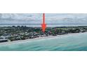 An aerial view of a beach house development along a pristine coastline at 2944 Gulf Of Mexico Dr, Longboat Key, FL 34228