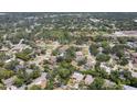 Expansive aerial view of a residential area featuring mature trees and well-maintained homes at 4079 Woodview Dr, Sarasota, FL 34232