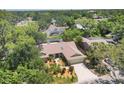 Scenic aerial view of a home nestled within a lush, green residential neighborhood at 4079 Woodview Dr, Sarasota, FL 34232