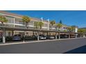 Well-maintained condo parking area with carports and lush landscaping at 4420 Exeter Dr # L104, Longboat Key, FL 34228