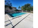 Refreshing in-ground pool with a concrete deck, perfect for relaxation and outdoor fun at 4444 Swift Rd # 14, Sarasota, FL 34231