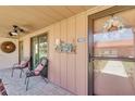 Inviting front porch with coastal decorations and comfortable seating at 6462 Draw Ln # 72, Sarasota, FL 34238
