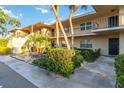 Well-kept condo exterior boasting mature landscaping and a clean facade, creating an appealing curb presence at 6999 W Country Club N Dr # 224, Sarasota, FL 34243