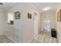 Bright hallway features tile floors, neutral walls, and stylish decor at 6999 W Country Club N Dr # 224, Sarasota, FL 34243