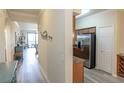 Inviting hallway leading to the kitchen and the living room at 7005 River Hammock Dr # 204, Bradenton, FL 34212