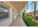 Exterior walkway featuring well-maintained landscaping and building facade at 7301 29Th Avenue W Dr # 108, Bradenton, FL 34209