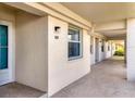 Exterior walkway showcases unit 108 and its well-lit entry at 7301 29Th Avenue W Dr # 108, Bradenton, FL 34209