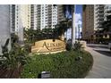 Elegant signage for Alinari at Rosemary Place surrounded by manicured greenery at 800 N Tamiami Trl # 604, Sarasota, FL 34236