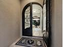Grand foyer entrance showcasing an elegant doorway, tile flooring and an open floorplan at 8316 Portlight Ct, Lakewood Ranch, FL 34202