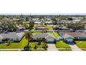 Charming single-story home featuring a lush, manicured lawn and a well-maintained exterior at 913 64Th W St, Bradenton, FL 34209