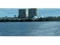 Water view of two condo buildings with a circus tent between them at 130 Riviera Dunes Way # 304, Palmetto, FL 34221