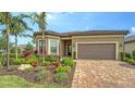 Charming home boasts vibrant landscaping, well-manicured lawn, and inviting curb appeal at 17905 Waterville Pl, Bradenton, FL 34202